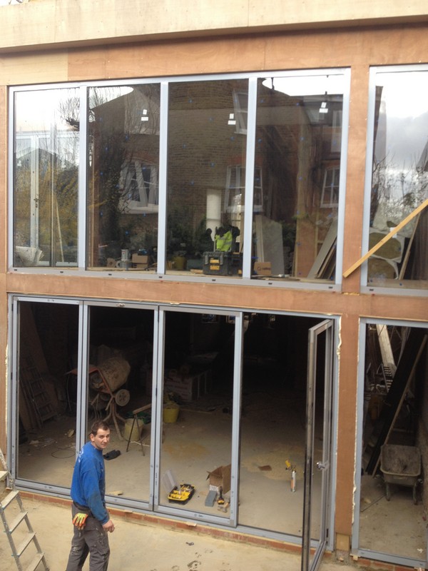 Aluminium bi-fold doors with two-storey glazing in Ruislip