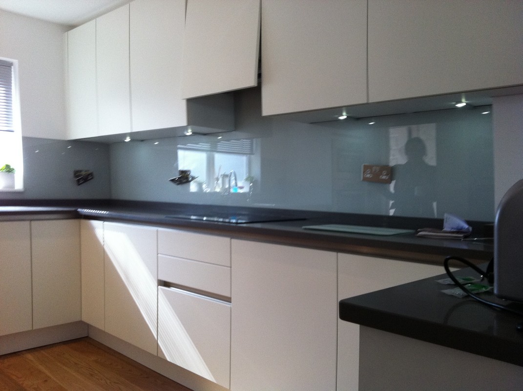 Grey glass kitchen splashback with LED lighting in Ruislip