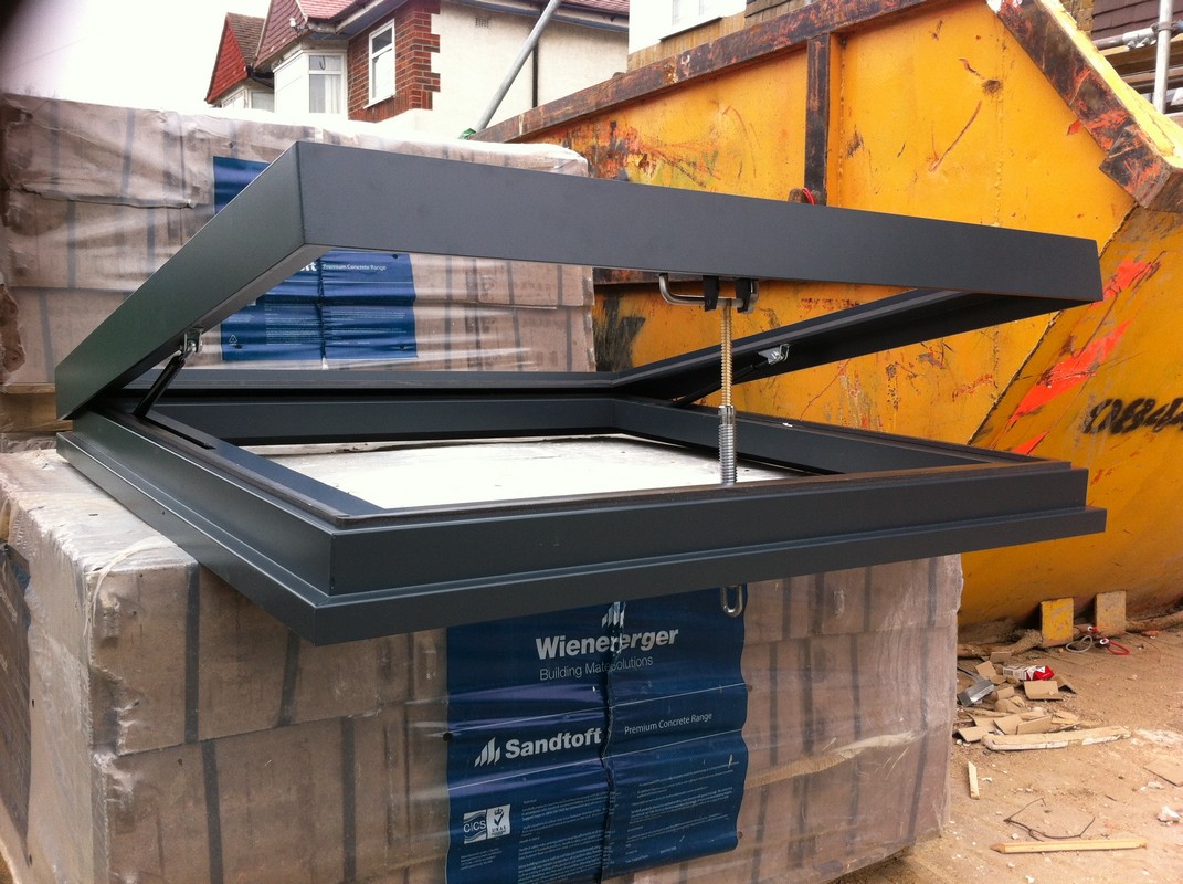 Opening flat roof skylight in anthracite grey installed in Ruislip
